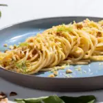 Spaghetti con colatura di alici, limone e nocciole